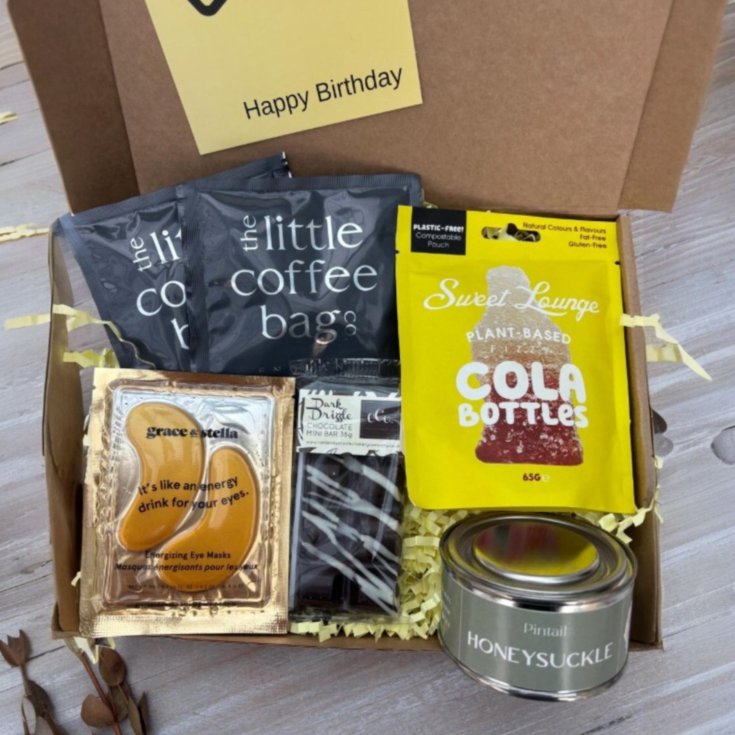One Box of Peace gift box for Dad's birthday, containing coffee bags, eye masks, chocolate, cola bottles, and honeysuckle candle.