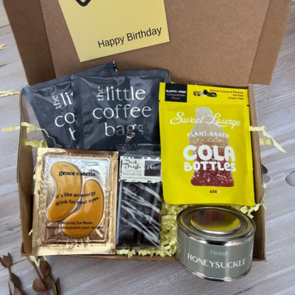 One Box of Peace gift box for Dad's birthday, containing coffee bags, eye masks, chocolate, cola bottles, and honeysuckle candle.