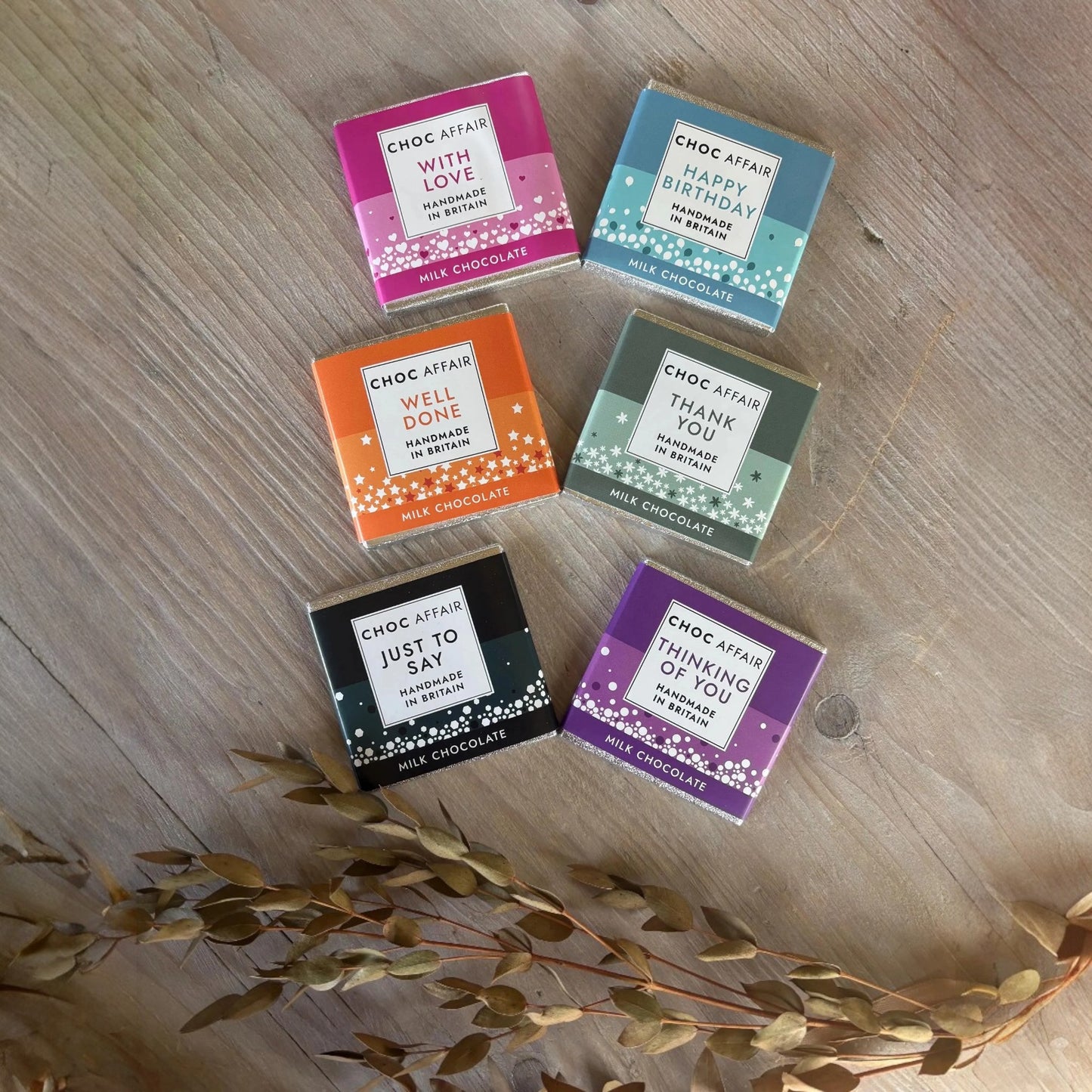 One Box of Peace gift set with five mini milk chocolate bars, each with a different message and colourful wrapper.