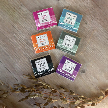 One Box of Peace gift set with five mini milk chocolate bars, each with a different message and colourful wrapper.